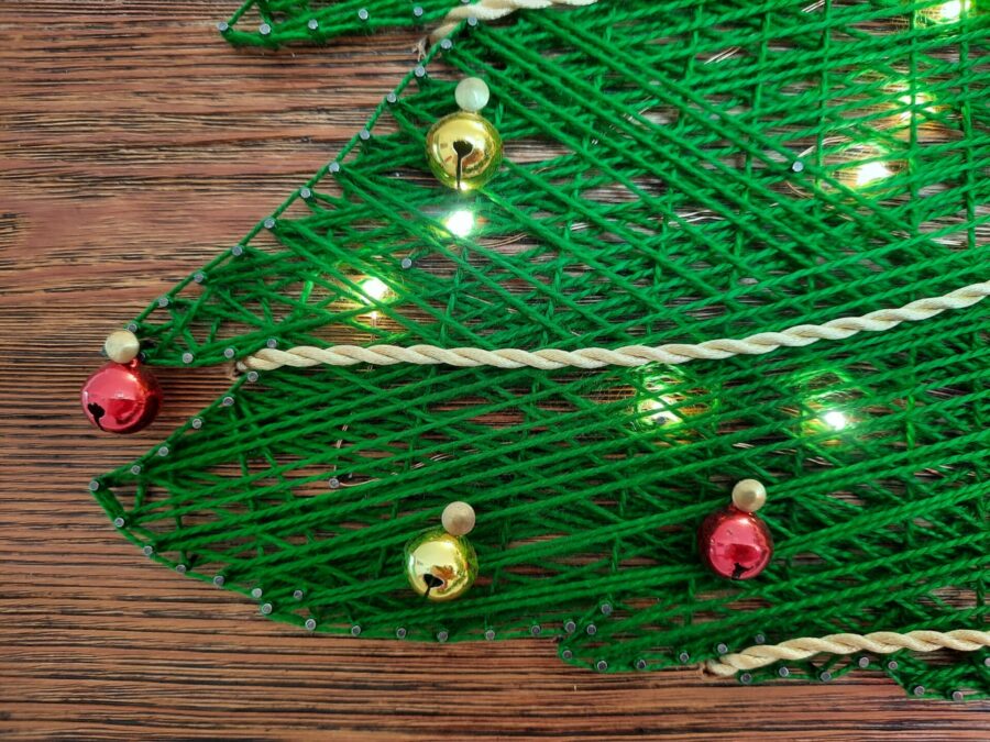 A multimaterial string art Christmas tree with LED lights
