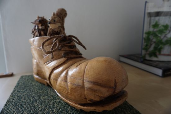 Mountain boot sculpted in wood