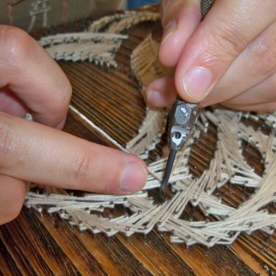 String art weaving with hollow punch