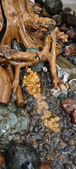 Real tree with epoxy resin stream pedestal