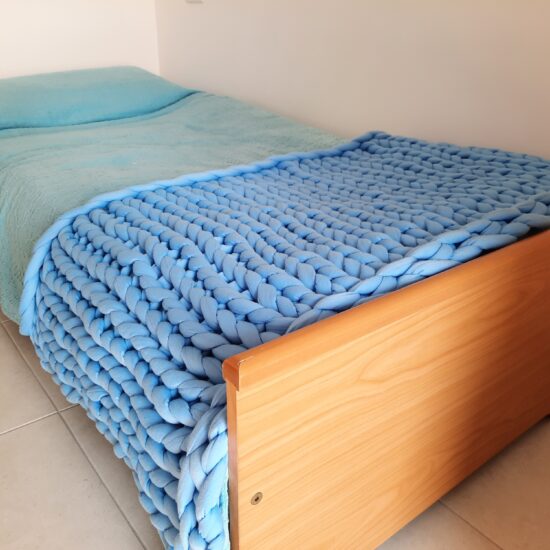 Giant yarn knitted blanket