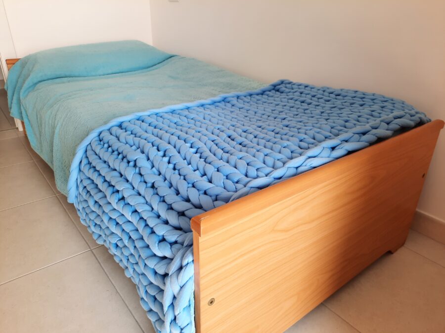 Giant yarn knitted blanket