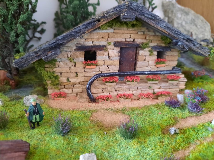Mountain diorama with real rocks and epoxy resin, dedicated to Celtica Festival: detail of the cottage