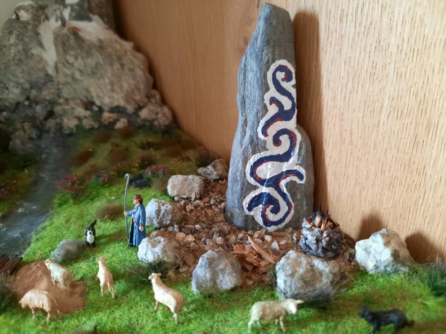 Mountain diorama with real rocks and epoxy resin, dedicated to Celtica Festival: detail of the Menhir with bonfire