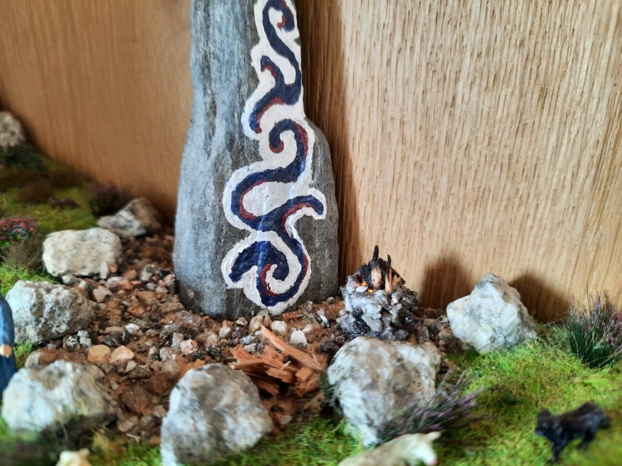 Mountain diorama with real rocks and epoxy resin, dedicated to Celtica Festival: detail of the Menhir with bonfire