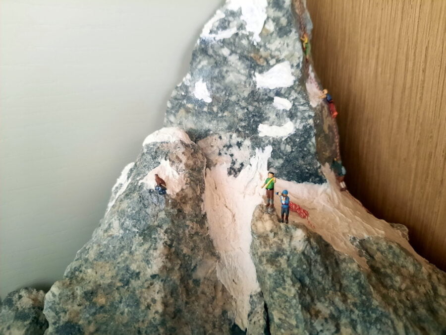 Mountain diorama with real rocks and epoxy resin, dedicated to Celtica Festival: detail of the climbers with the eagle