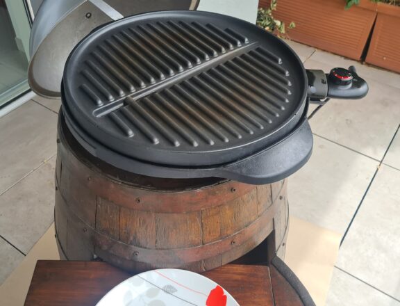 Restored old wine barrel: the grill on top