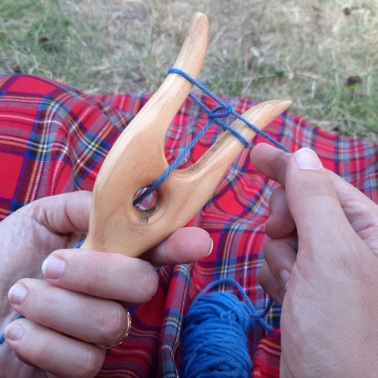 How to Lucet: step 4.4, turn clockwise and adjust stitches to the center
