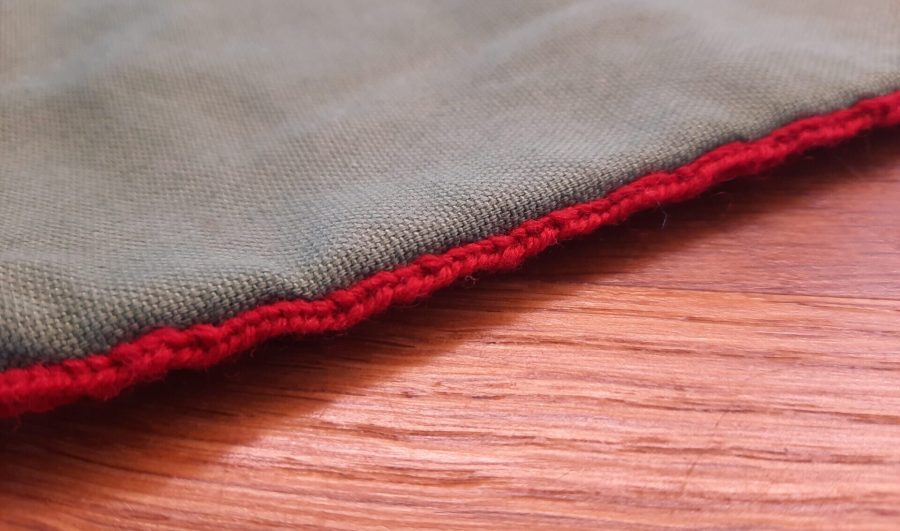 Medieval pouch with detail of lucet braid on the side