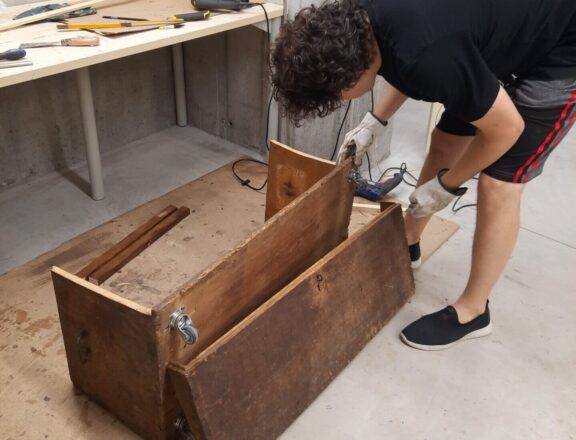 The steamer trunk cut into two pieces