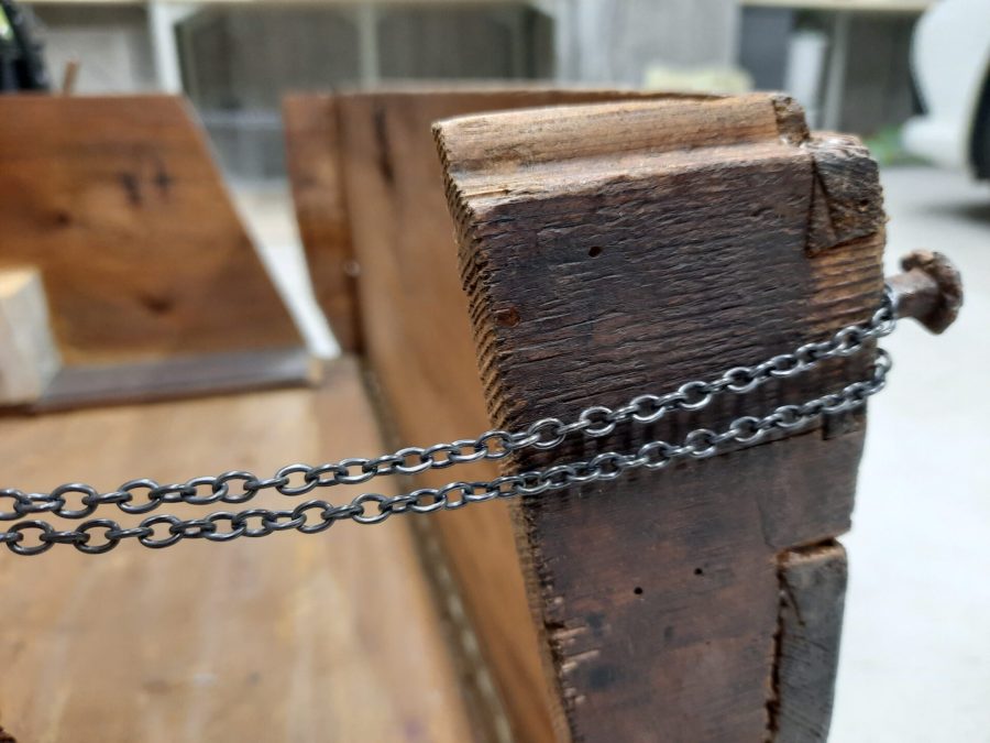 Steamer trunk with chains installed, detail