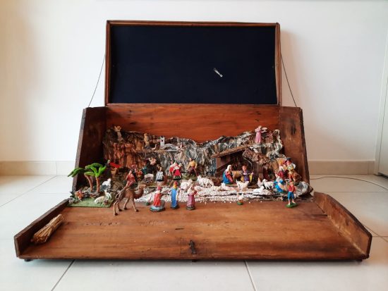 Restored steamer trunk with Nativity scene diorama, open with statues