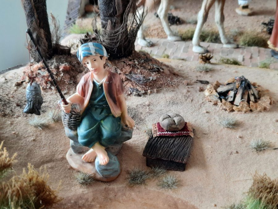 Nativity diorama inside an antique steamer trunk: the fisherman in the Oasis