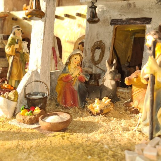 Nativity diorama inside an antique steamer trunk: the holy family