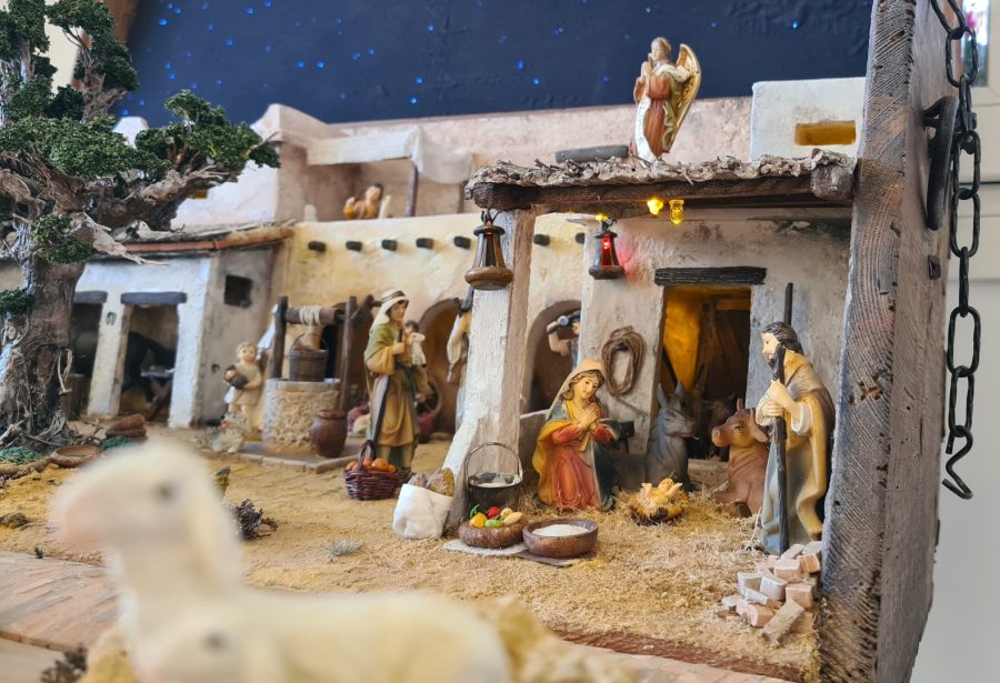 Nativity diorama inside an antique steamer trunk: the holy family
