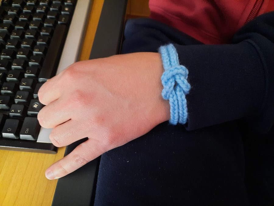 Light blue lucetted bracelet with decorative knot