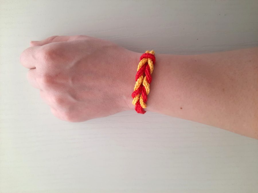 Red and jellow lucetted bracelet with multiple knotting