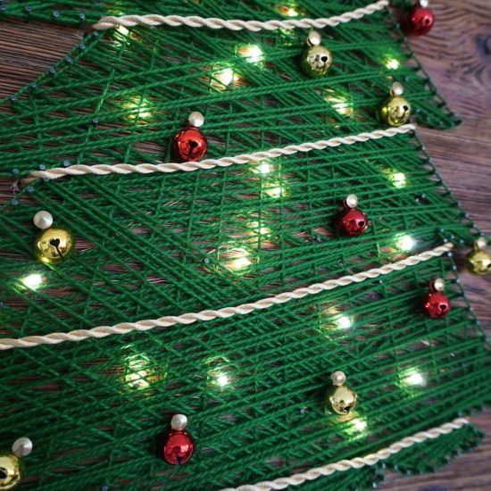 A multimaterial string art Christmas tree with LED lights