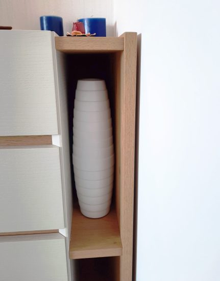 Open shelving addition to a chest of drawers, detail