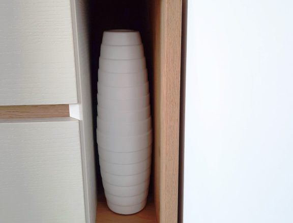 Open shelving addition to a chest of drawers, detail