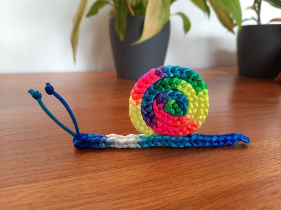 Little toy snail made with the lucet