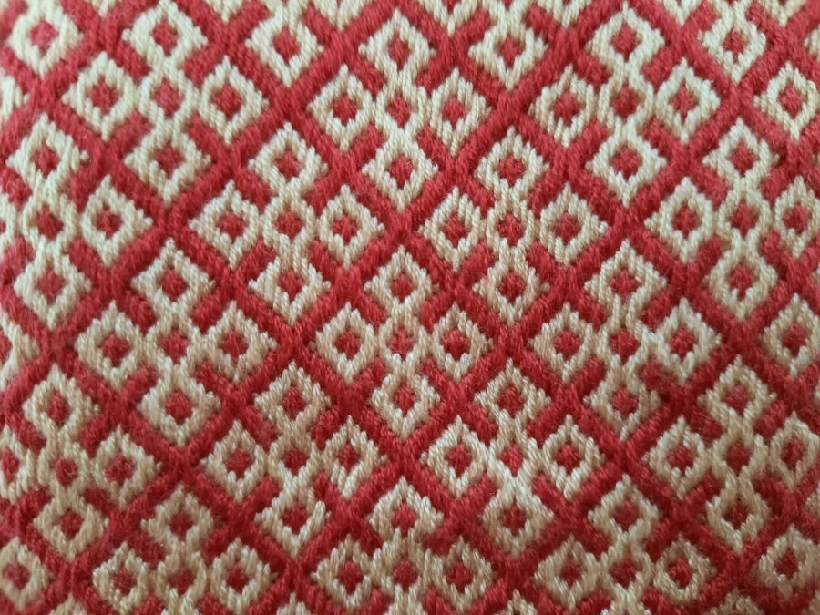Red and yellow Medieval purse, embroidered with German brick stitch and with lucetted strap and cord: detail of the embroidery