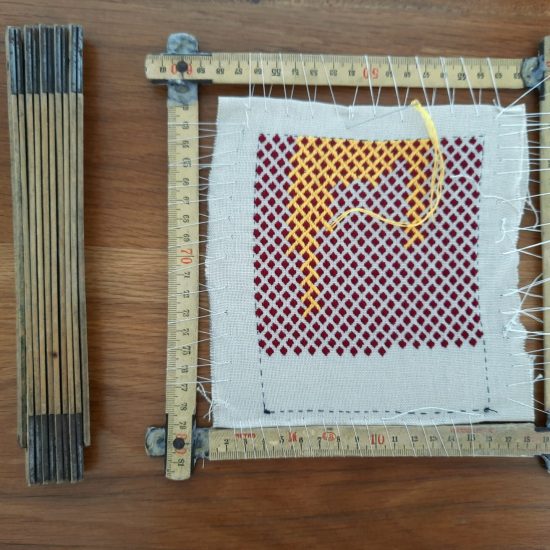 The folding ruler before and after being repurposed as an embroidery frame