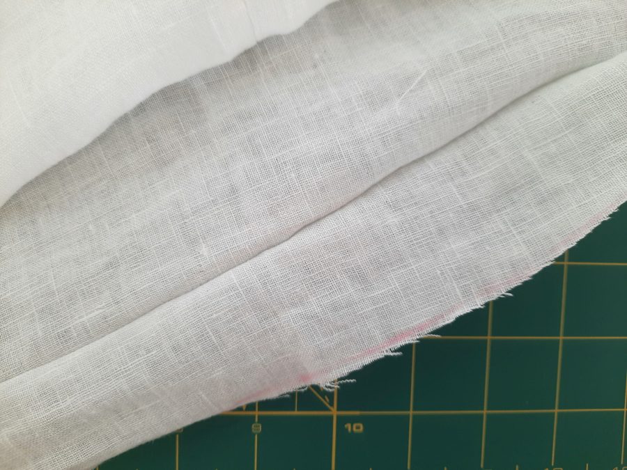 Turning a thrifted linen caftan into a shirt: making the bottom hem
