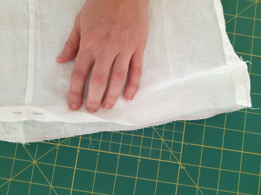 Turning a thrifted linen caftan into a shirt: making the bottom hem