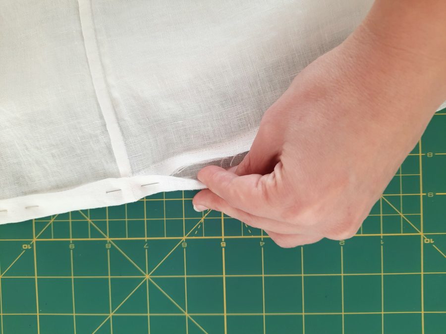 Turning a thrifted linen caftan into a shirt: making the bottom hem