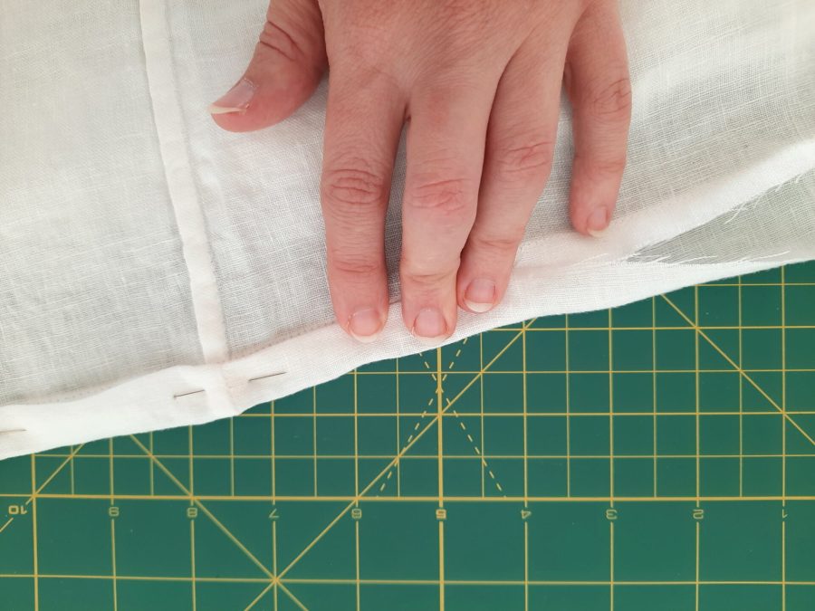 Turning a thrifted linen caftan into a shirt: making the bottom hem