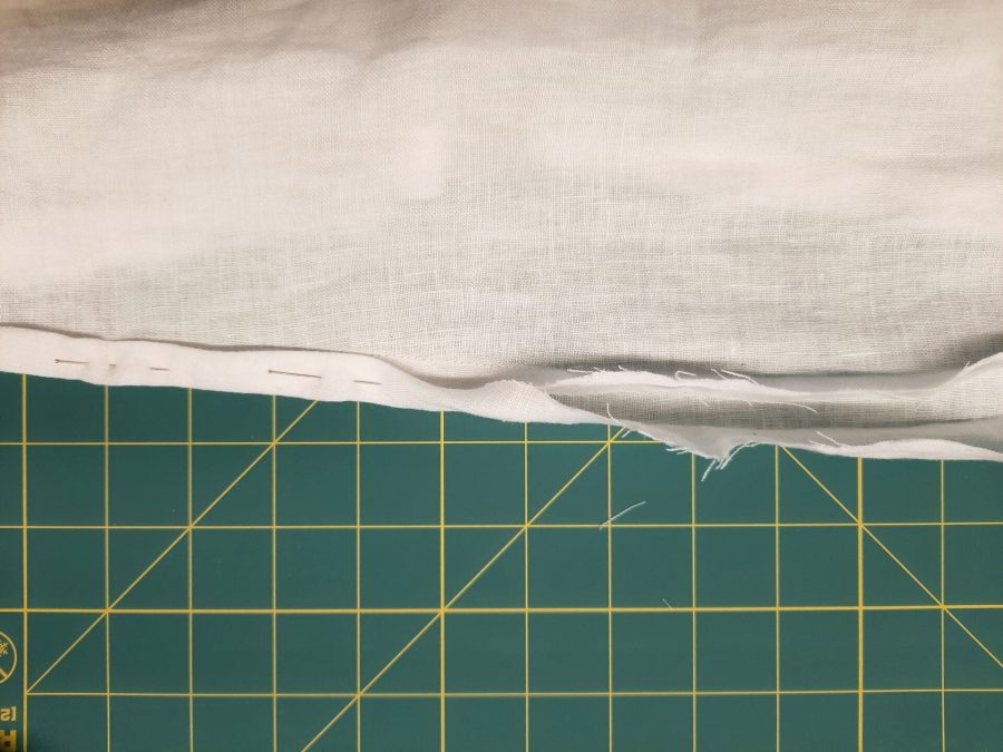 Turning a thrifted linen caftan into a shirt: making the bottom hem
