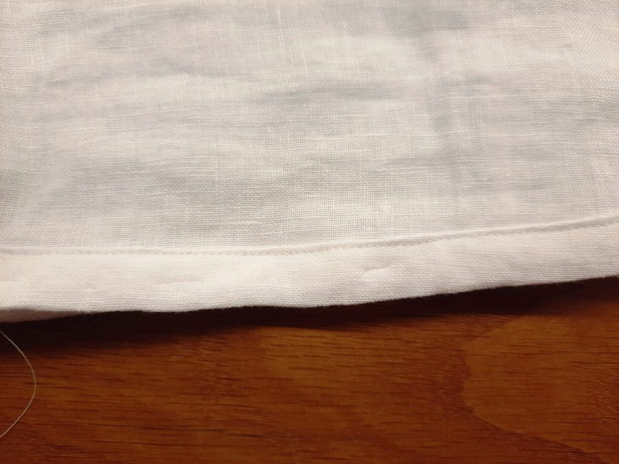 Turning a thrifted linen caftan into a shirt: the bottom hem