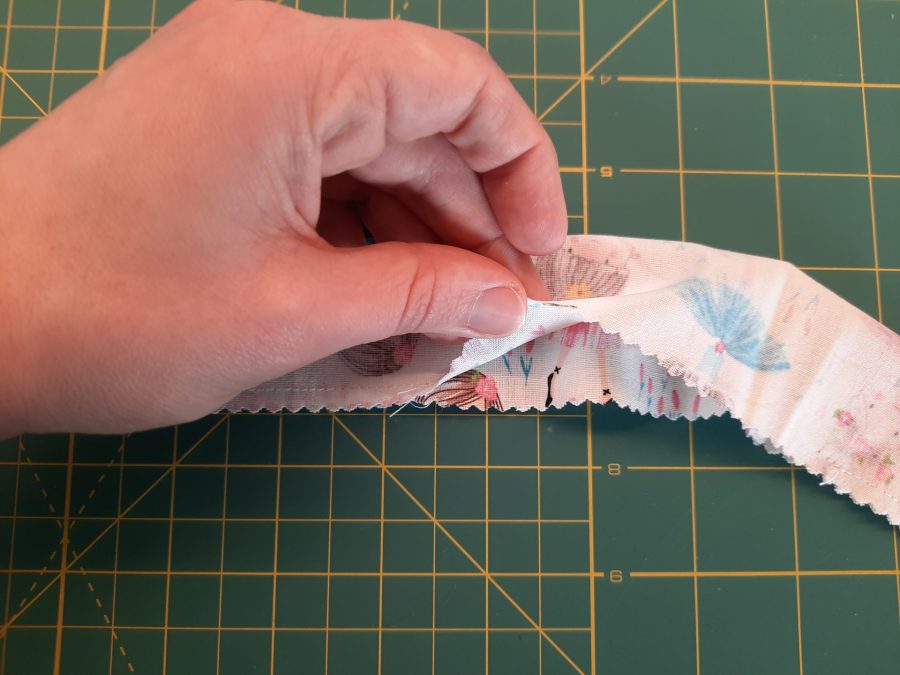 Sewing a scrunchie: make a tube of fabric, short sides open. Also leave an opening in the middle of the bottom long side (it will be used later for turning upright)