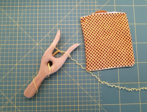 Brick stitch embroidered needle roll: making the cord with my lucet