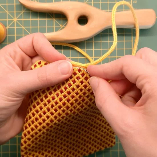 Brick stitch embroidered needle roll: sewing the lucetted cord