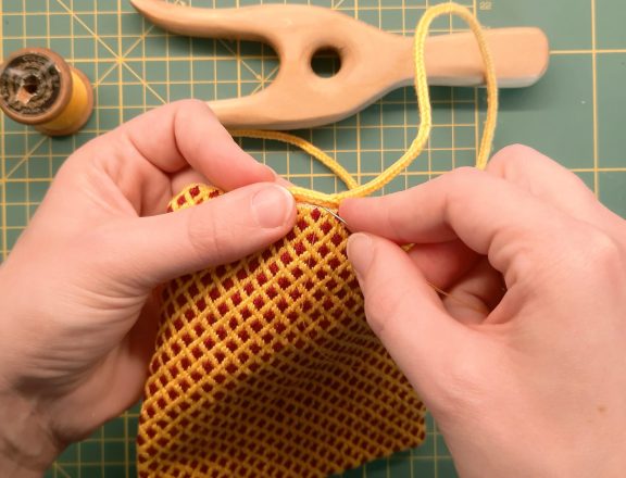 Brick stitch embroidered needle roll: sewing the lucetted cord
