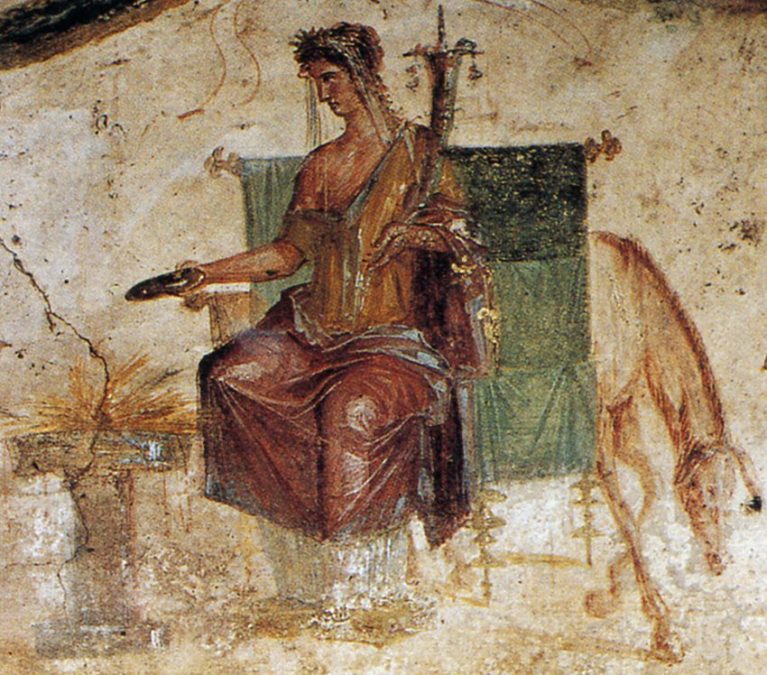 Rare depiction of Vesta in human form, as the central figure from the Lararium of a bakery at Pompeii, 1st century. Image from Wikimedia Commons