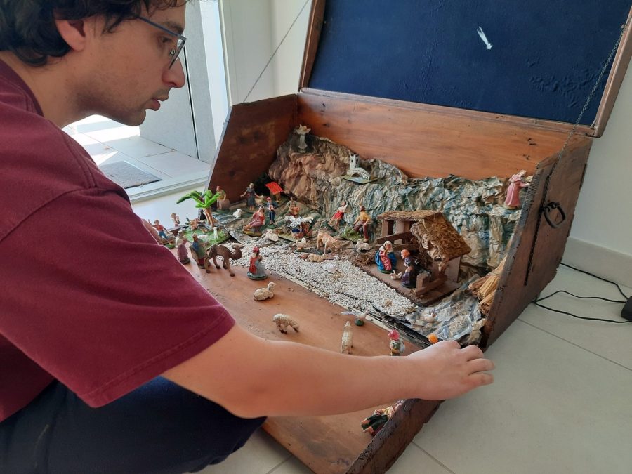 Placing our old statues in the restored steamer trunk to make a first Nativity scene