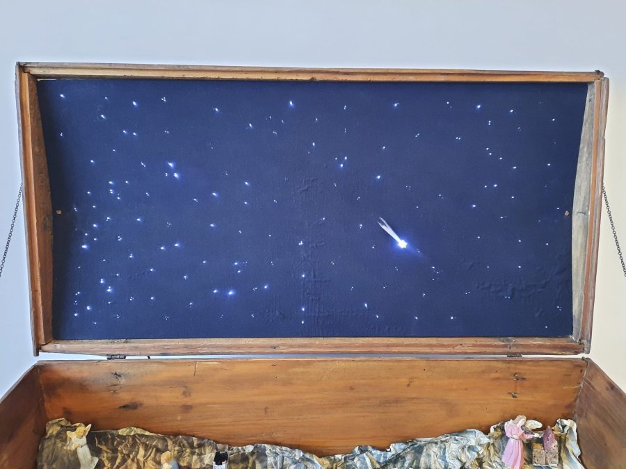 Detail of the lid of our restored steamer trunk, with stars and comet