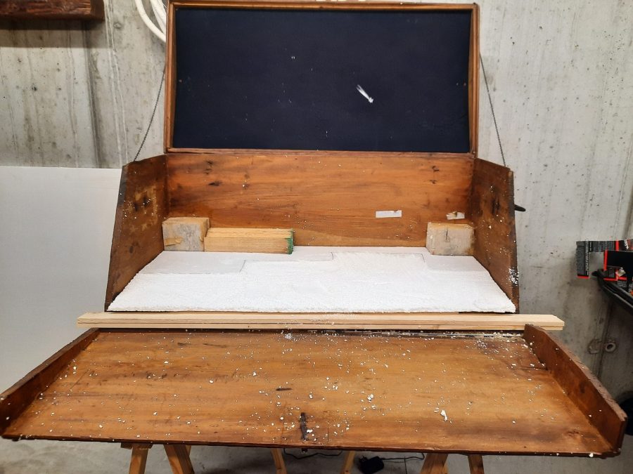 Making the landscape for our Christmas nativity diorama inside the steamer trunk