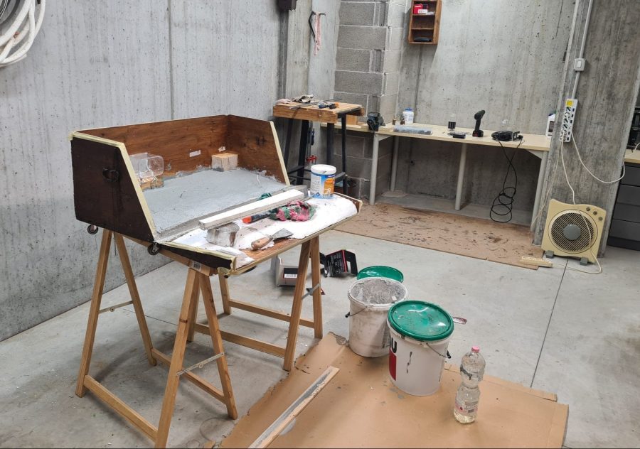 Making the landscape for our Christmas nativity diorama inside the steamer trunk: the cement coating