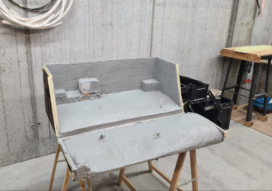 Making the landscape for our Christmas nativity diorama inside the steamer trunk: the cement coating