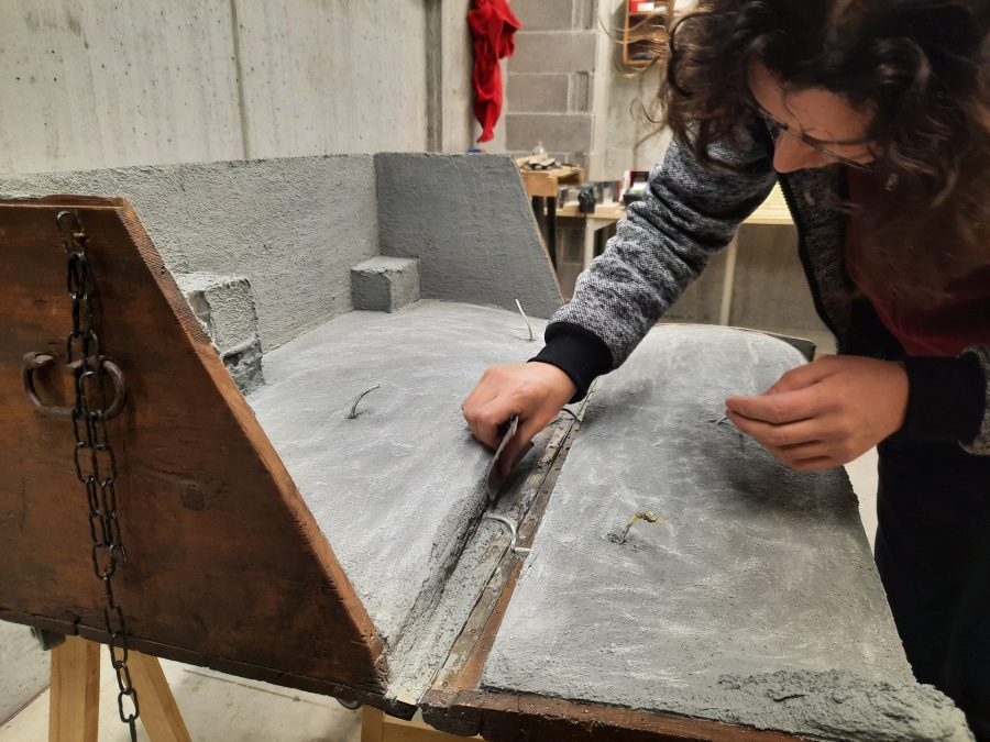Making the landscape for our Christmas nativity diorama inside the steamer trunk: the cement coating