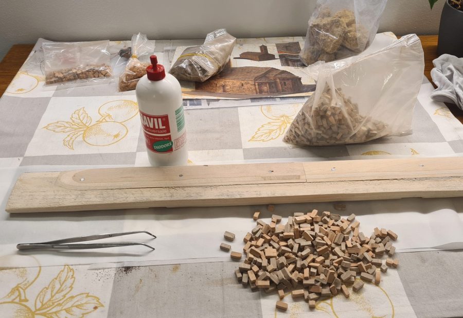 Constructing the Roman road for our Christmas nativity diorama inside the steamer trunk