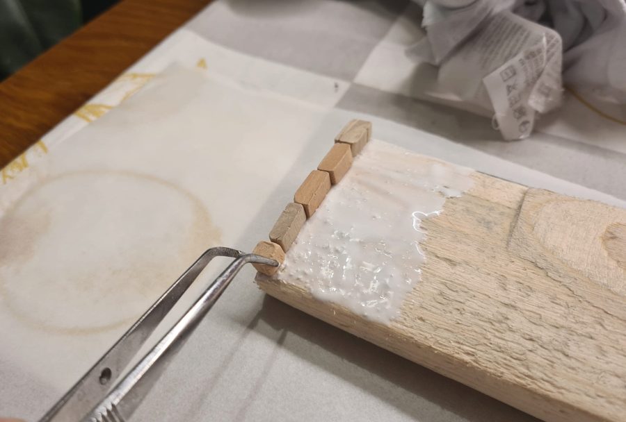 Constructing the Roman road for our Christmas nativity diorama inside the steamer trunk