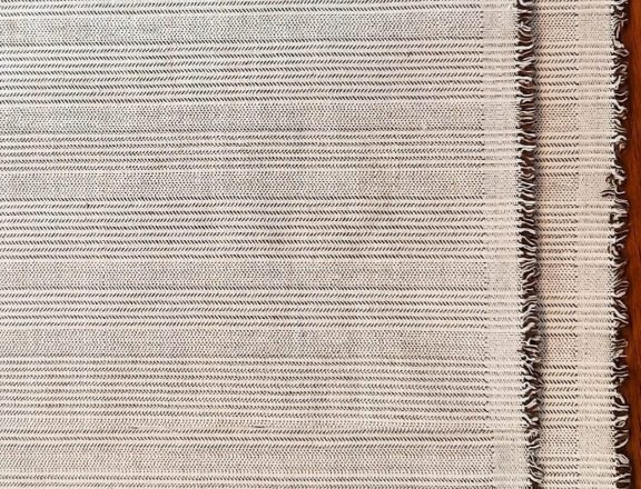 The striped piece of fabric I used for my embroidery project travel bag. Reversible weave and fringed selvedge.
