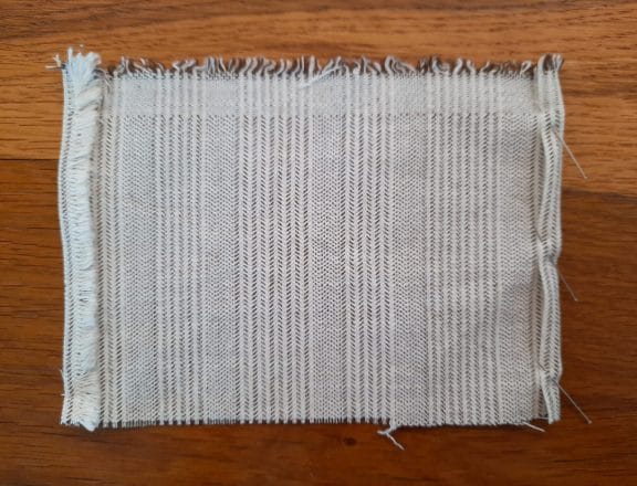 Preparing the pocket for my embroidery project travel bag: pin the hems