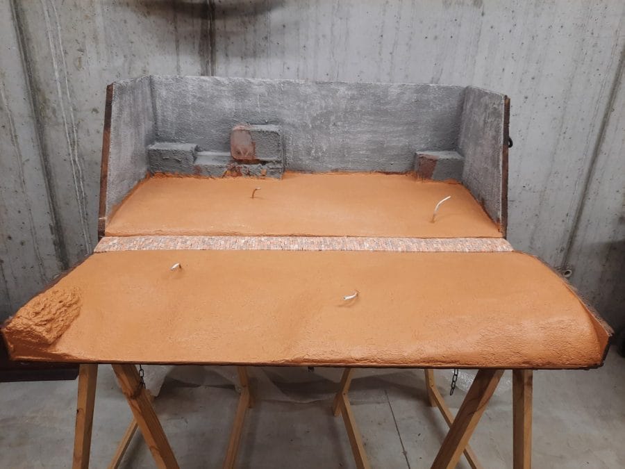 Making a Nativity diorama inside an antique steamer trunk: the basic terrain ready to receive its future Bethlehem features.