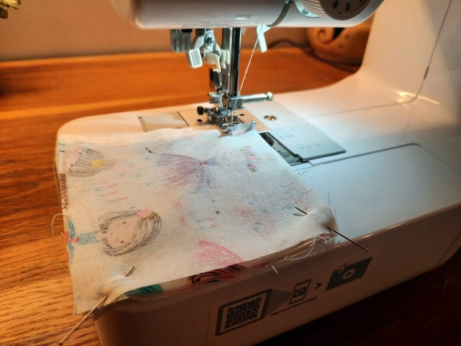 Sewing a corner bookmark: sew all the way around the edge of your fabric sandwich, leaving a turning gap along one side.